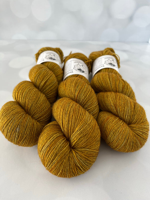 Tarnished Brass, Treasured Yak Toes Sock Yarn, goldenrod yellow yarn