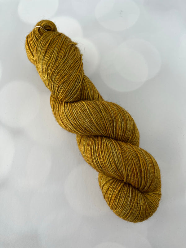 Tarnished Brass, Treasured Yak Toes Sock Yarn, goldenrod yellow yarn