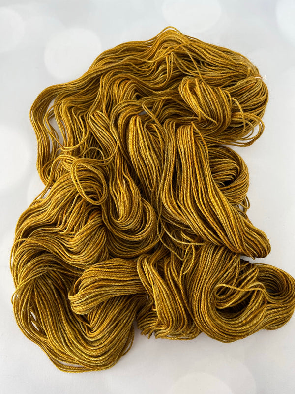 Tarnished Brass, Treasured Yak Toes Sock Yarn, goldenrod yellow yarn