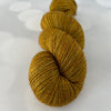 Tarnished Brass, Treasured Yak Toes Sock Yarn, goldenrod yellow yarn