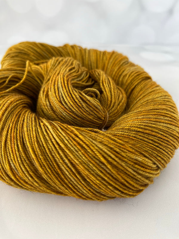 Tarnished Brass, Treasured Yak Toes Sock Yarn, goldenrod yellow yarn
